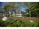 Stately home nestled amongst lush greenery with a charming front yard at 5653 Stetson Dr, Whitestown, IN 46052
