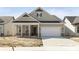 New construction home featuring a front porch and a two-car garage at 5653 Stetson Dr, Whitestown, IN 46052