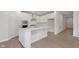 Modern kitchen featuring white cabinets, stainless appliances, quartz counters and center island with breakfast bar at 5653 Stetson Dr, Whitestown, IN 46052