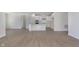 Open floor plan showcasing the kitchen and living area with plenty of space and natural light at 5653 Stetson Dr, Whitestown, IN 46052