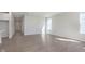 Open-concept living area is bathed in natural light and features hard surface floors throughout at 5653 Stetson Dr, Whitestown, IN 46052