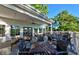 Covered outdoor dining area on a wood deck, featuring ceiling fan at 5653 Stetson Dr, Whitestown, IN 46052