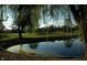 Scenic view of a pond surrounded by lush trees and a golf course at 5653 Stetson Dr, Whitestown, IN 46052