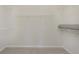 Walk-in closet with carpeted floors and wired shelving, offering ample storage space at 5653 Stetson Dr, Whitestown, IN 46052