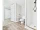Bathroom with a stand up shower, tile floors, and modern toilet at 612 Woodlawn Dr, Anderson, IN 46012