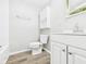 Bathroom featuring modern fixtures, updated paint, and toilet at 612 Woodlawn Dr, Anderson, IN 46012