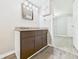 Bathroom vanity featuring modern fixtures, updated paint, and storage at 612 Woodlawn Dr, Anderson, IN 46012