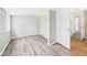 Bedroom with modern flooring, neutral paint, and natural light at 612 Woodlawn Dr, Anderson, IN 46012