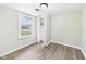 Serene bedroom with a light grey paint, with laminate flooring at 612 Woodlawn Dr, Anderson, IN 46012