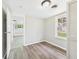 Bright bedroom featuring hardwood floors, natural light and neutral paint at 612 Woodlawn Dr, Anderson, IN 46012