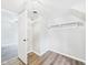 Walk-in closet featuring an organizational hanging rack and modern flooring at 612 Woodlawn Dr, Anderson, IN 46012