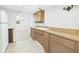 Cozy kitchen featuring wood cabinets, and plenty of natural light at 612 Woodlawn Dr, Anderson, IN 46012