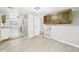 Spacious Laundry room featuring light colored flooring, overhead cabinets, and essential hookups at 612 Woodlawn Dr, Anderson, IN 46012