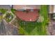 Aerial view of a backyard with a wooden deck and meticulous landscaping at 6141 Madison Ave, Indianapolis, IN 46227