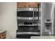 Modern stainless steel microwave, oven, and refrigerator at 6141 Madison Ave, Indianapolis, IN 46227
