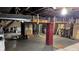 Unfinished basement with open ceiling, concrete floor, and visible utilities at 6141 Madison Ave, Indianapolis, IN 46227