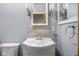 Bathroom featuring a white vanity with a sink, decorative mirrors, and a toilet at 6141 Madison Ave, Indianapolis, IN 46227