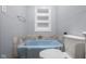Cozy bathroom featuring a sky-blue tub, grey walls, and a built-in storage nook at 6141 Madison Ave, Indianapolis, IN 46227