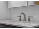 Close-up of bathroom sink with marble countertop and modern faucet at 6141 Madison Ave, Indianapolis, IN 46227