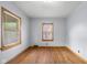 Inviting bedroom with hardwood floors and natural light streaming through the windows at 6141 Madison Ave, Indianapolis, IN 46227
