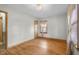 Bedroom with hardwood floors, neutral walls, and natural light from a window at 6141 Madison Ave, Indianapolis, IN 46227