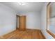 Bedroom with hardwood floors, neutral paint and a closet at 6141 Madison Ave, Indianapolis, IN 46227