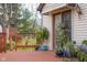 Inviting wooden deck featuring beautiful potted plants and a sliding glass door at 6141 Madison Ave, Indianapolis, IN 46227