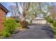 Spacious two-car detached garage offering ample storage and parking space on a paved driveway at 6141 Madison Ave, Indianapolis, IN 46227