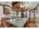 Spacious kitchen with stainless steel appliances and a large island with seating at 6141 Madison Ave, Indianapolis, IN 46227