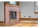 Living room featuring a brick fireplace and hardwood floors at 6141 Madison Ave, Indianapolis, IN 46227