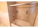 Bathroom with tiled shower and glass door enclosure with integrated storage niches at 6144 S Irwin St, Indianapolis, IN 46237