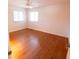 Bedroom featuring hardwood floors, ceiling fan and two windows with natural light at 6144 S Irwin St, Indianapolis, IN 46237