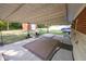 An expansive covered patio is an ideal location for relaxation and entertainment at 6144 S Irwin St, Indianapolis, IN 46237