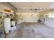 Spacious garage with laundry hookups, water heater, and plenty of room for storage and parking at 6144 S Irwin St, Indianapolis, IN 46237