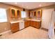 Bright kitchen with wood cabinets, white countertops, and modern appliances at 6144 S Irwin St, Indianapolis, IN 46237