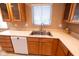 Kitchen featuring wooden cabinetry, a stainless steel sink, and ample counter space at 6144 S Irwin St, Indianapolis, IN 46237