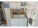 Laundry area featuring a white washer and dryer set, shelving, and storage at 6144 S Irwin St, Indianapolis, IN 46237