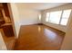 Spacious and bright living room with hardwood floors and large windows for natural light at 6144 S Irwin St, Indianapolis, IN 46237