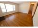 Bright living room featuring hardwood floors and a large window for natural light at 6144 S Irwin St, Indianapolis, IN 46237