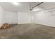 Spacious garage with concrete floors, ample storage, and access door to the home's interior at 6222 Fairview Dr, McCordsville, IN 46055