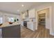 Kitchen with stainless steel appliances, white cabinets, and a center island at 6222 Fairview Dr, McCordsville, IN 46055