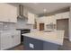 Well-appointed kitchen with stainless steel appliances, a center island, and white cabinets at 6222 Fairview Dr, McCordsville, IN 46055