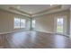Bright living room with hardwood floors, large windows, and modern finishes at 6222 Fairview Dr, McCordsville, IN 46055