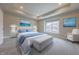 Main bedroom featuring a tufted headboard, a bench, and neutral decor at 6222 Fairview Dr, McCordsville, IN 46055