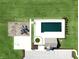 Aerial view of community pool, playground, and parking areas surrounded by green space and landscaping at 6767 Sonora Blvd, Brownsburg, IN 46112