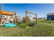 Backyard features a wooden pergola with patio seating, swing set, and a trampoline at 6767 Sonora Blvd, Brownsburg, IN 46112