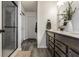 Bathroom featuring a glass shower and a double vanity sink at 6767 Sonora Blvd, Brownsburg, IN 46112