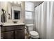 Cozy half bathroom with a modern vanity, stylish fixtures, and ample natural light at 6767 Sonora Blvd, Brownsburg, IN 46112