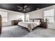 Cozy bedroom featuring a dark ceiling, a comfortable bed, and ample natural light from the windows at 6767 Sonora Blvd, Brownsburg, IN 46112
