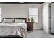 Bedroom featuring a comfortable bed, a nightstand, and a window offering natural light at 6767 Sonora Blvd, Brownsburg, IN 46112